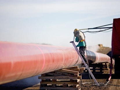 Technician Working on Pipeline